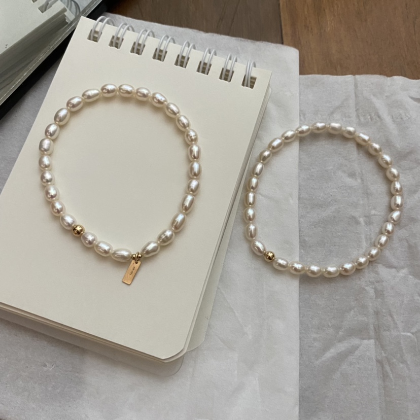 天然淡水珍珠4-5㎜米形有生长纹配14k包金弹力款手串手链